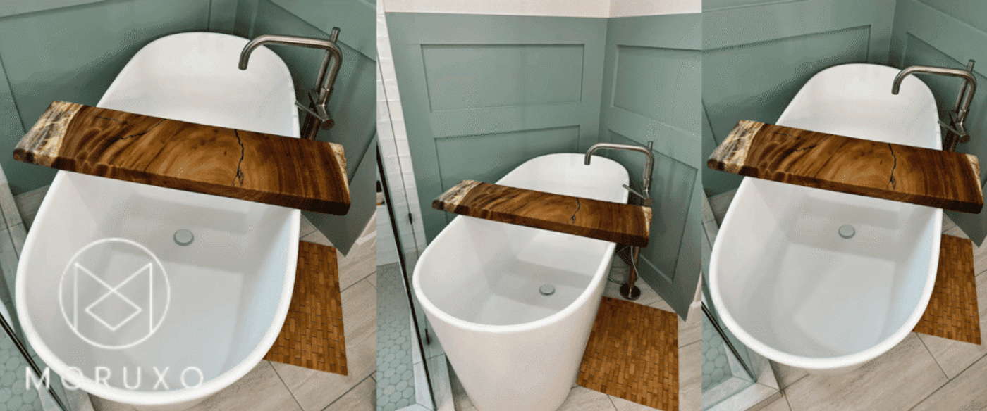White freestanding bathtub with a polished wooden bath tray across top, modern floor-mounted faucet, green shiplap wall and tiled floor.
