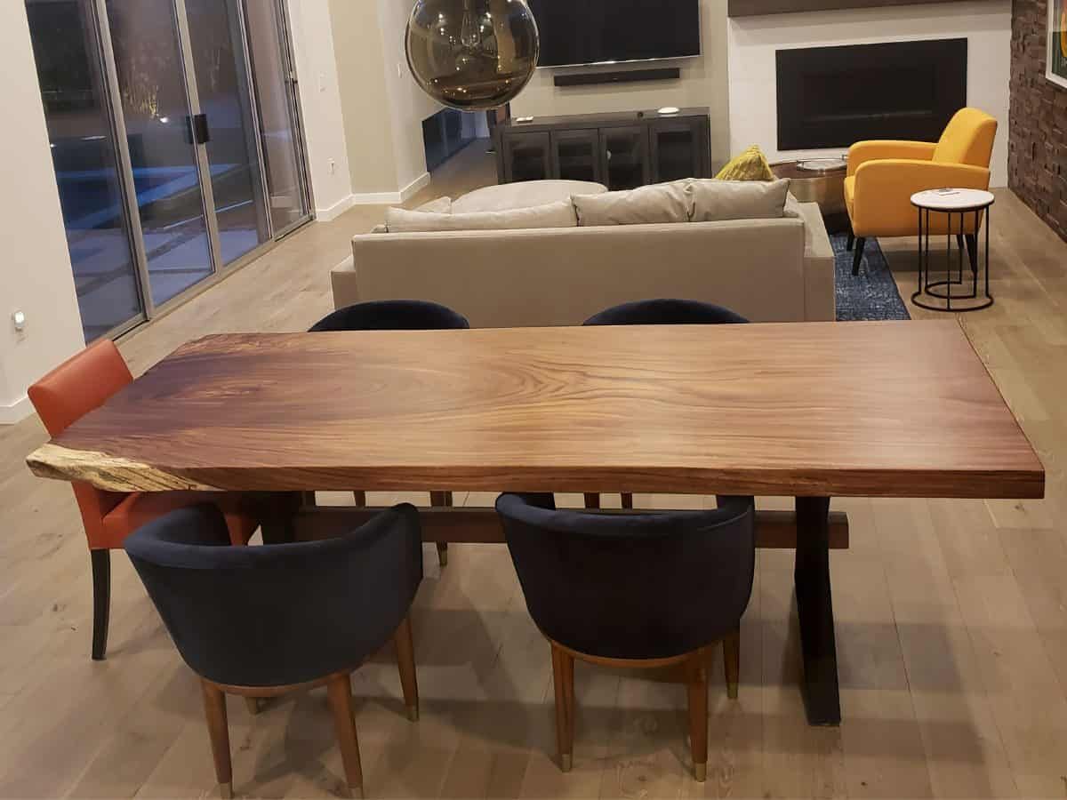 Custom made live edge dining table in a modern living room