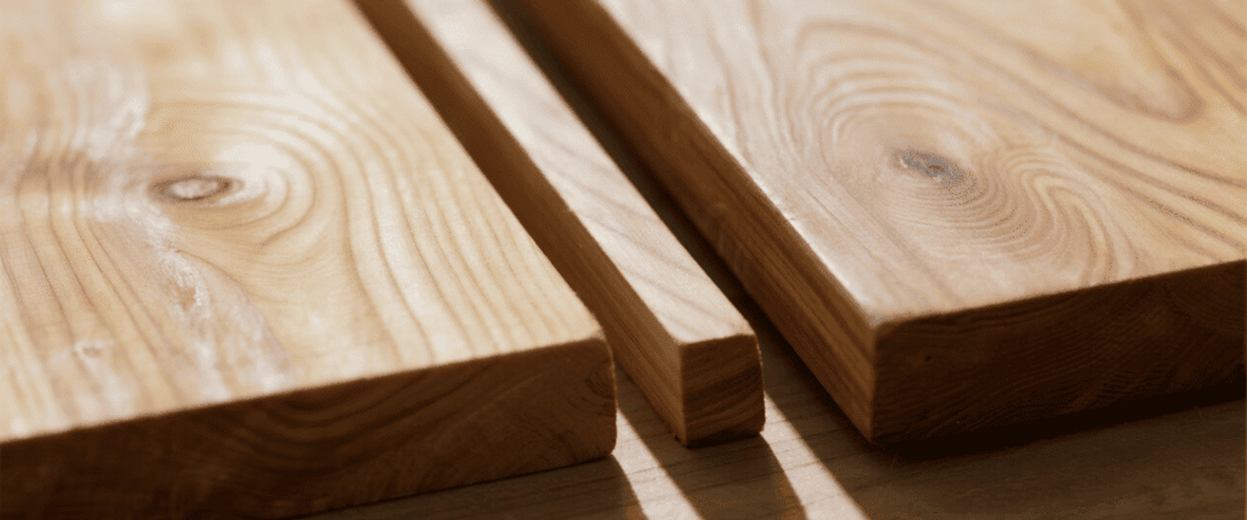Teak wood samples one with a water-based finish clear, non-yellowing, matte, and one unfinished.