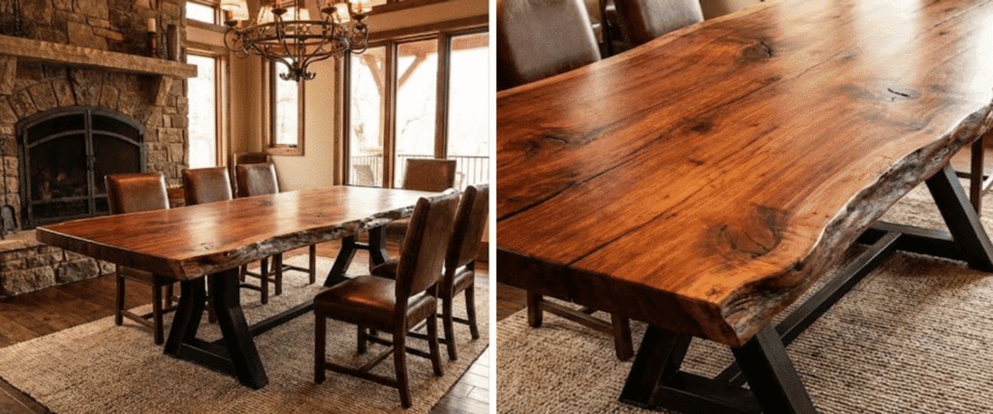 Live-edge walnut dining table with rich grain and black metal X‑style legs, set on a textured woven rug