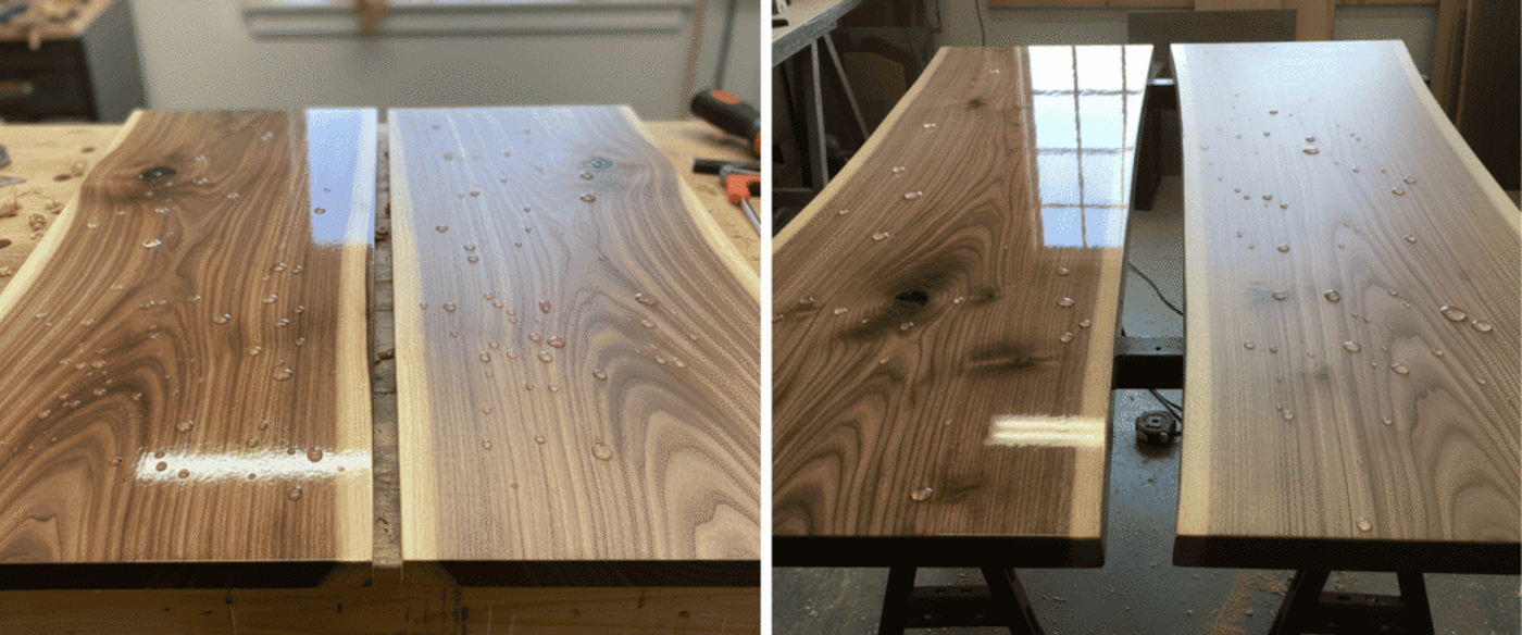 Two polished walnut live-edge slabs on a workbench with water droplets highlighting the grain and shop tools blurred in background.