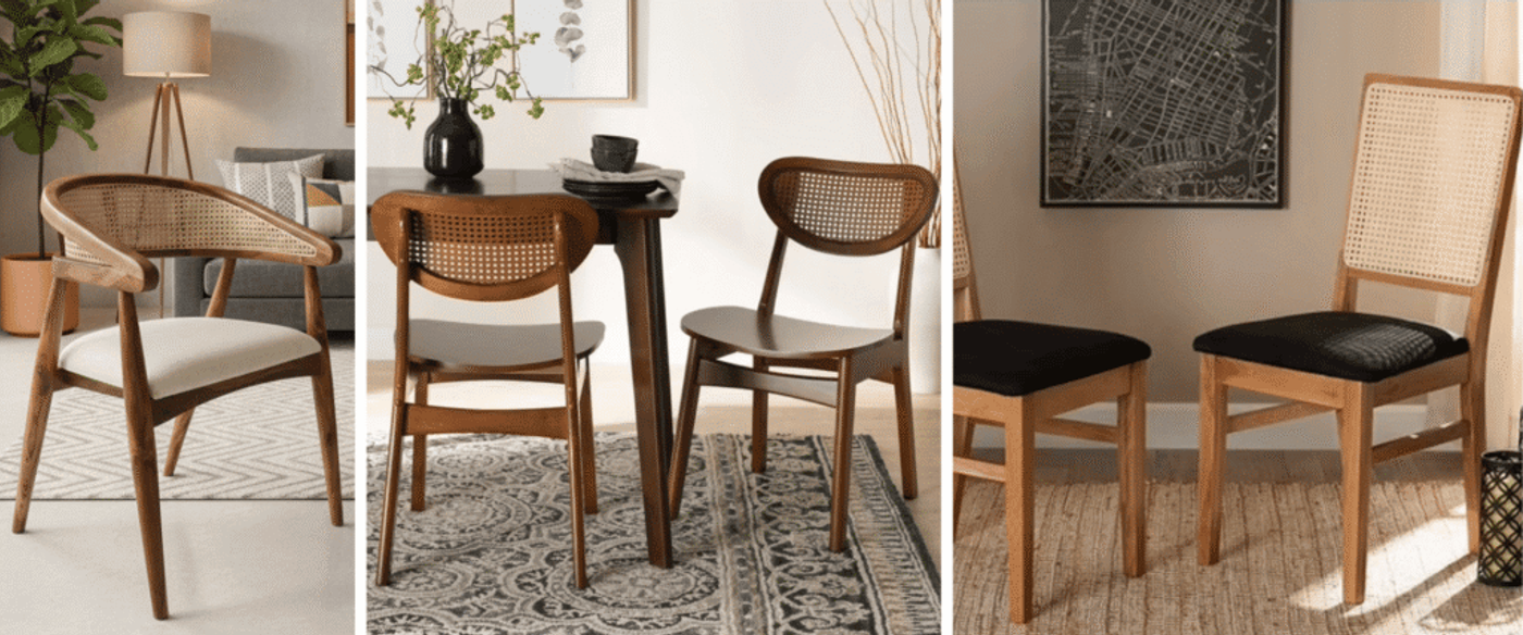 Pair of mid-century wooden dining chairs with woven cane backs and black upholstered seats, set in a cozy sunlit room