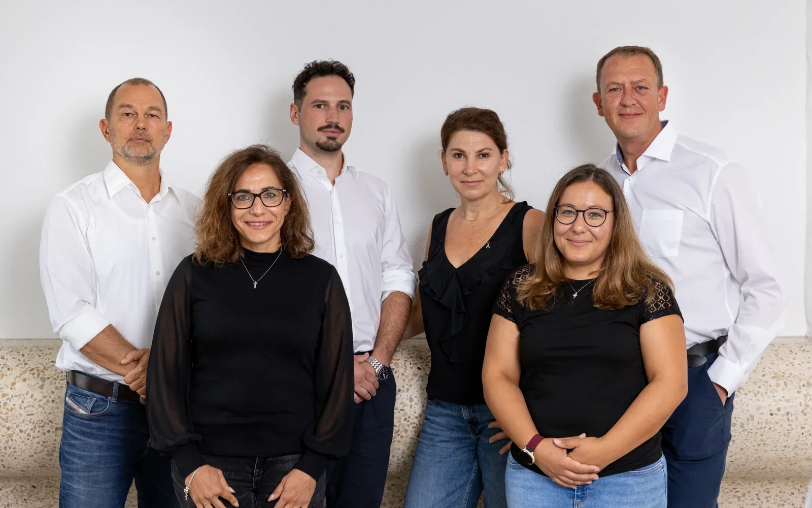 Six ETS AG employees in a group photo.
