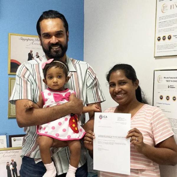 Dilanka, a Singapore Top Immigration client, holding their ICA approval letter