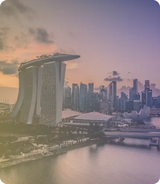 The Marina Bay skyline at dusk, seen across the water