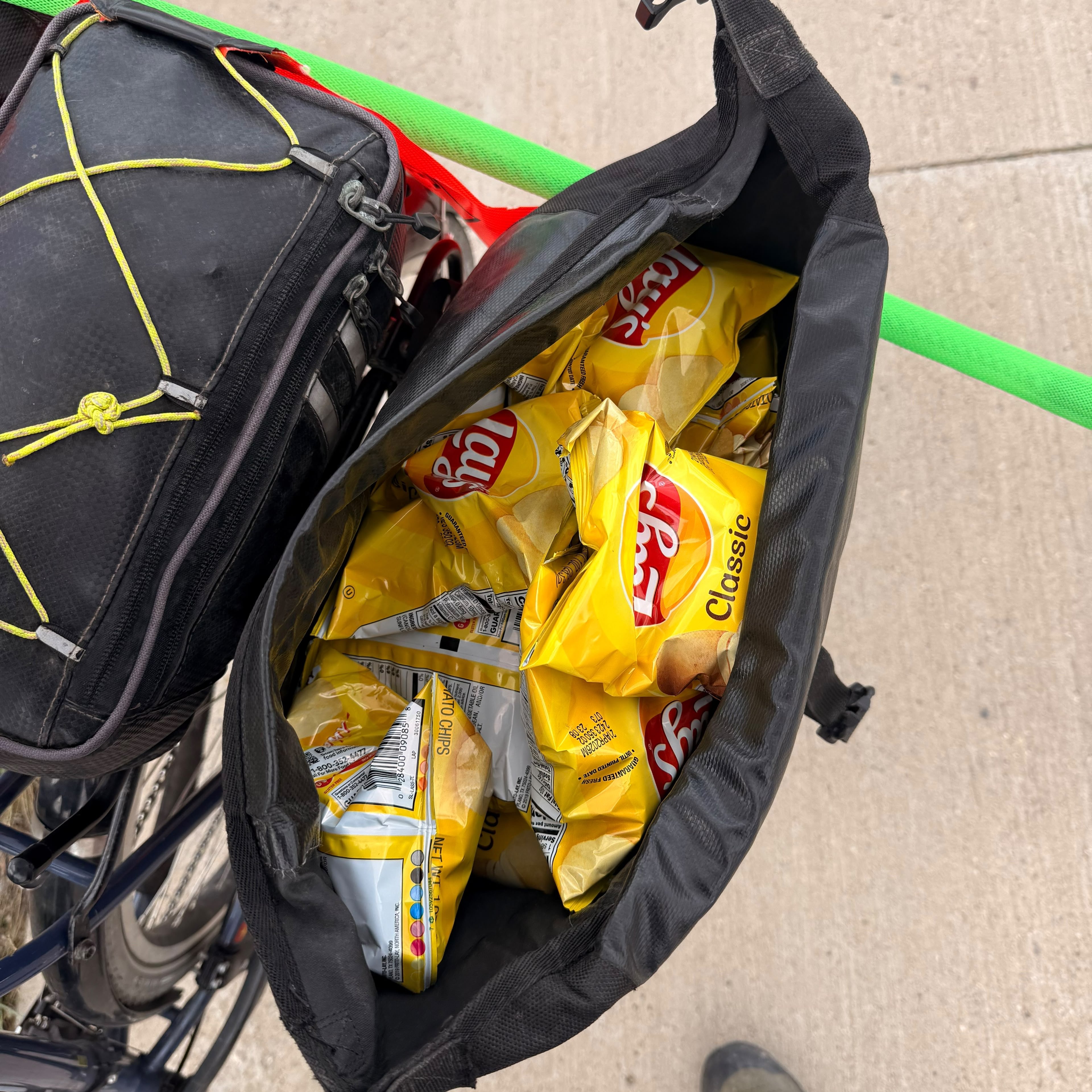 Packets of Lay's stuffed into a bicycle pannier