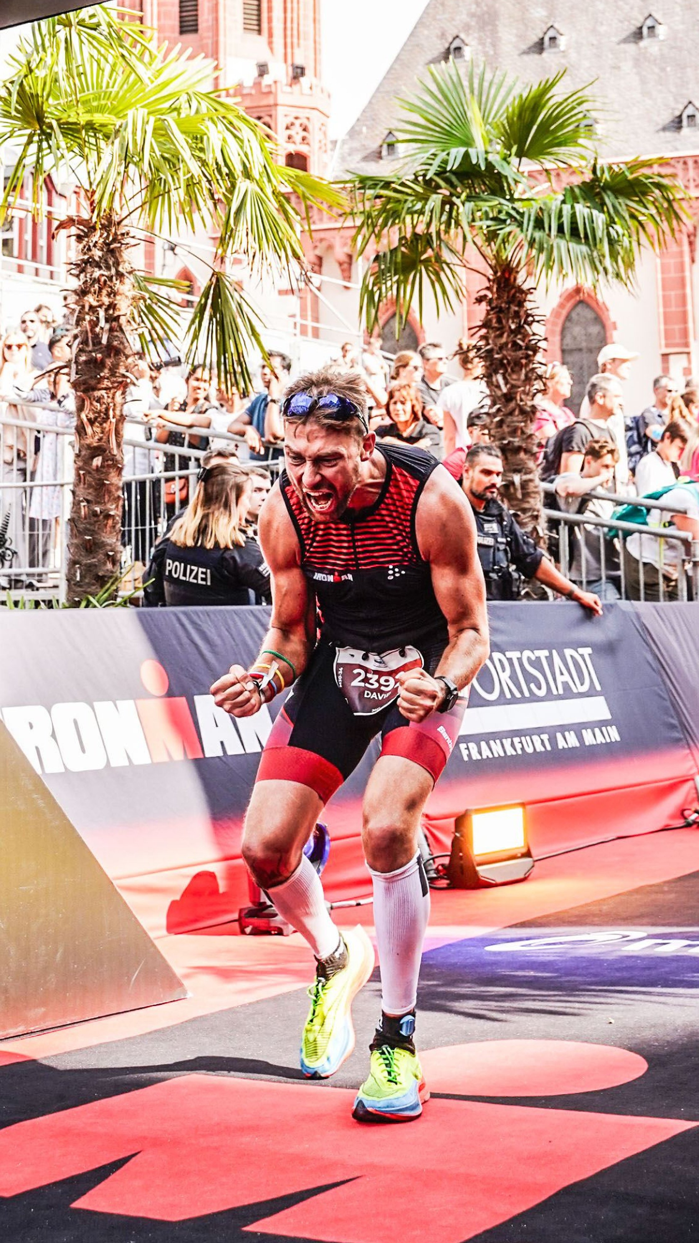 David Bossek crossing the finish line of an Ironman triathlon in Frankfurt.