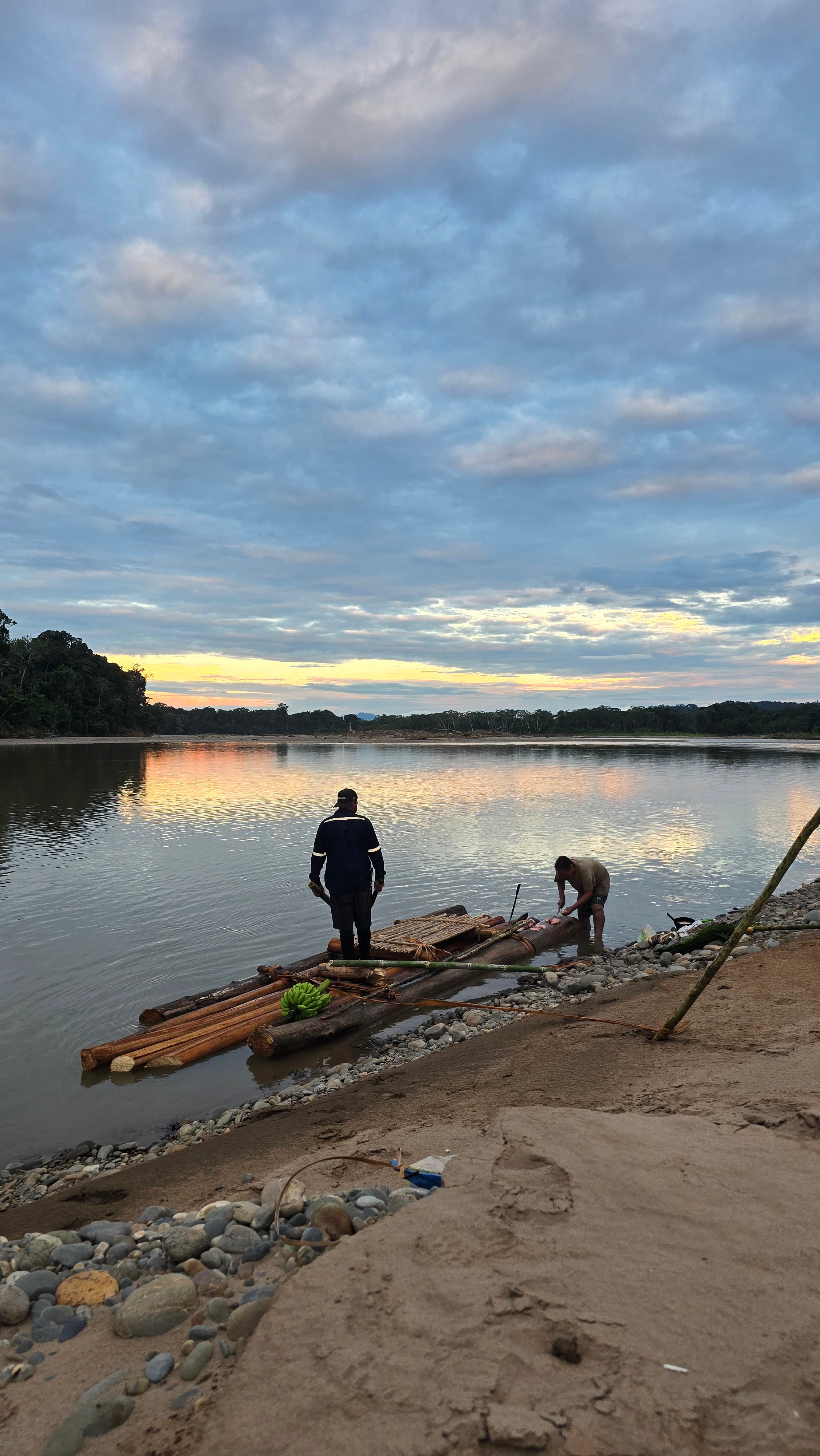 David Bossek and his guide building a raft during a survival trip in the Bolivian Amazon.