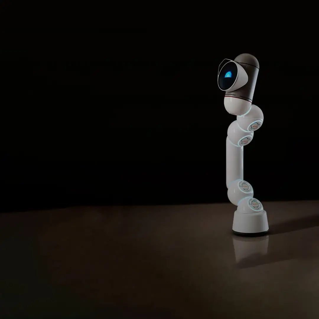 A white robotic arm with a blue camera eye in a dark studio