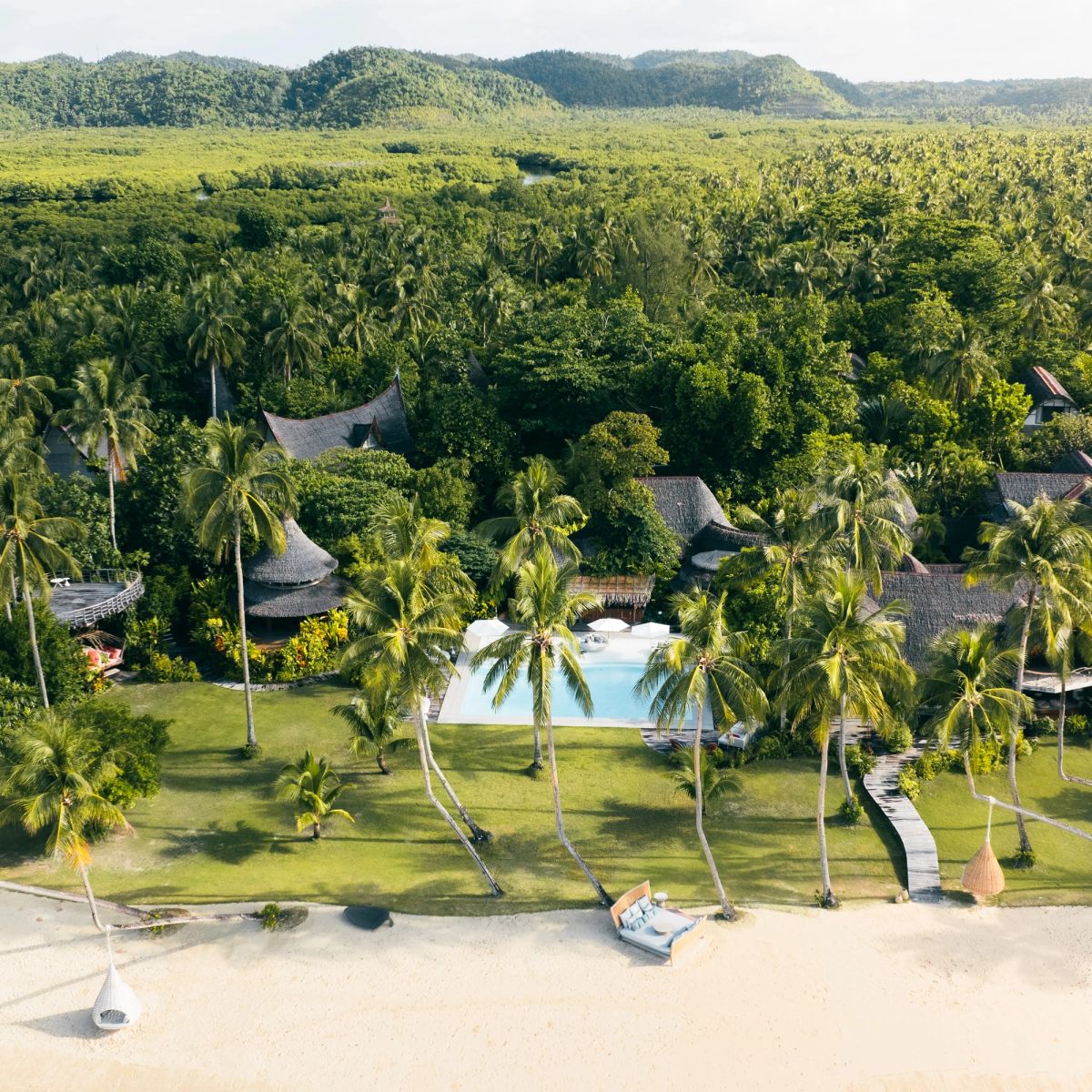 The pool and gardens of Nay Palad Hideaway from the air