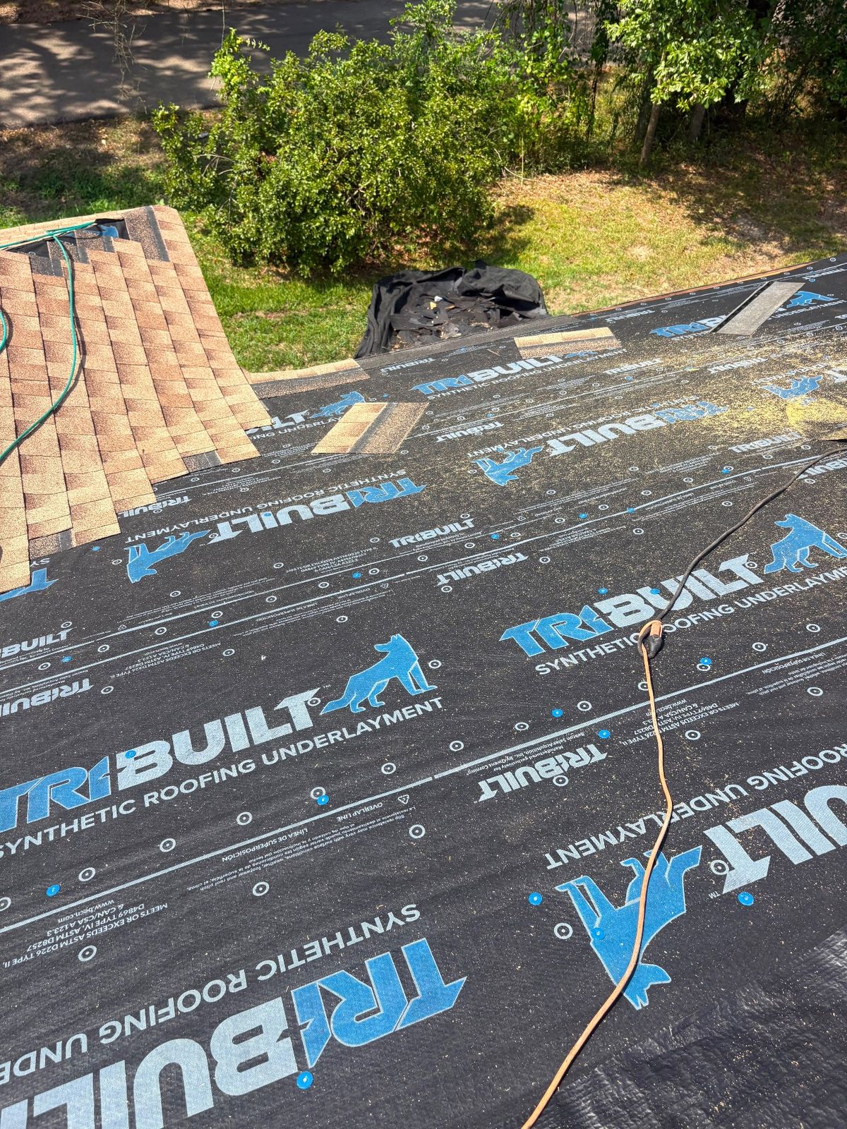 In Progress photo of a GAF Timberline HDZ shingle roof in Shakewood being installed by Southeast Roofing in McComb, MS.