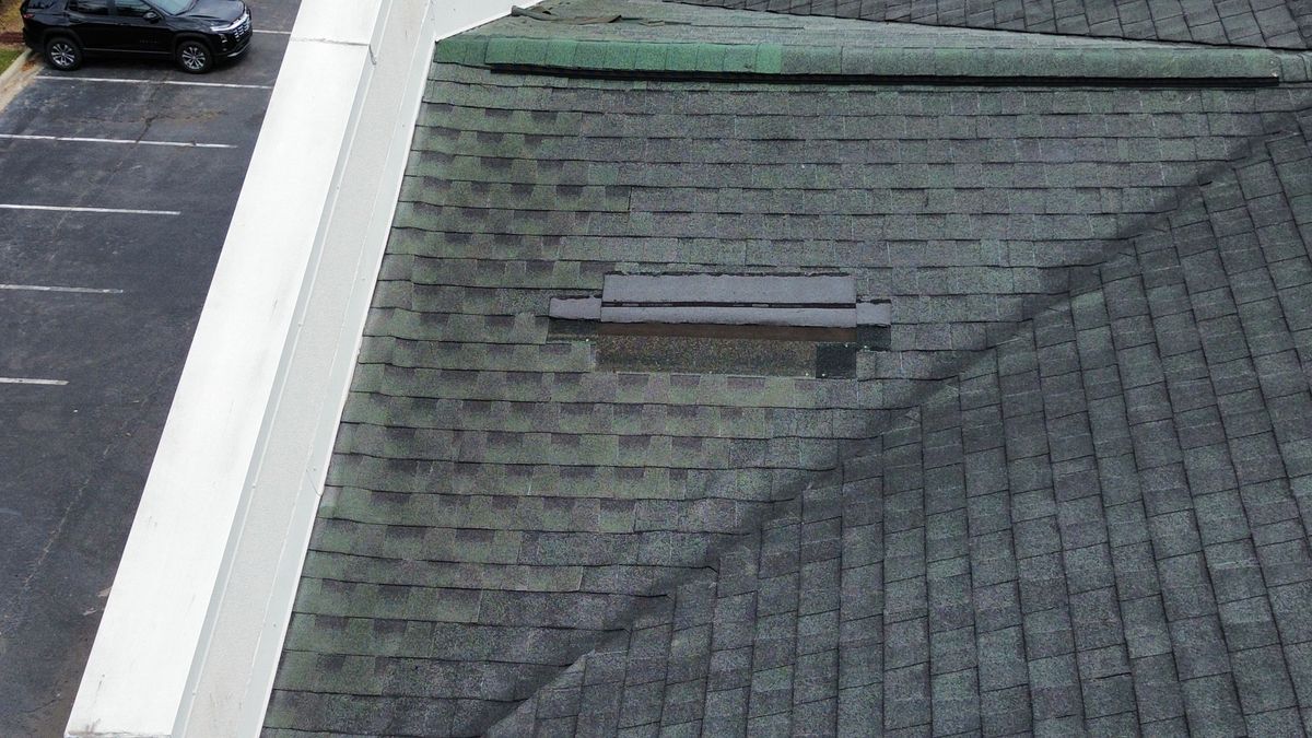 Before photo of a storm-damaged roof before work by Southeast Roofing in Picayune, MS.