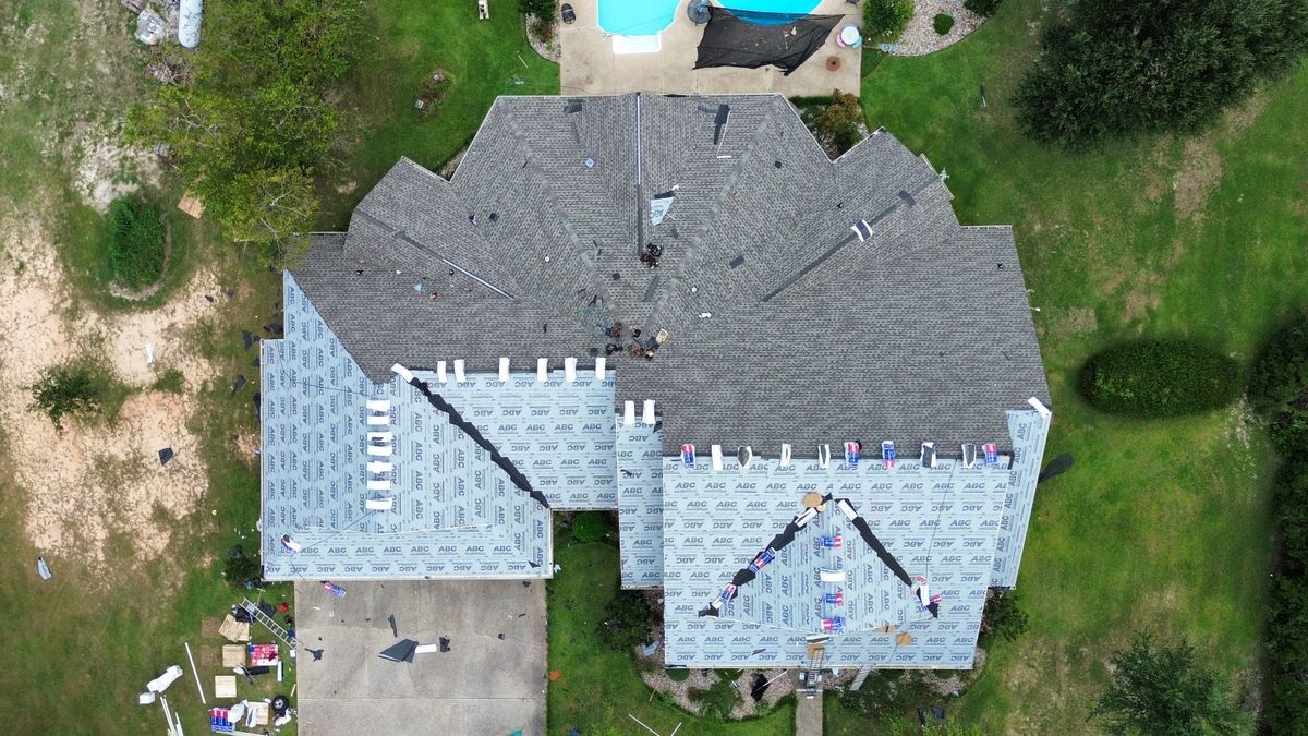In Progress photo of a GAF Timberline HDZ shingle roof in Weathered Wood being installed by Southeast Roofing in Purvis, MS.