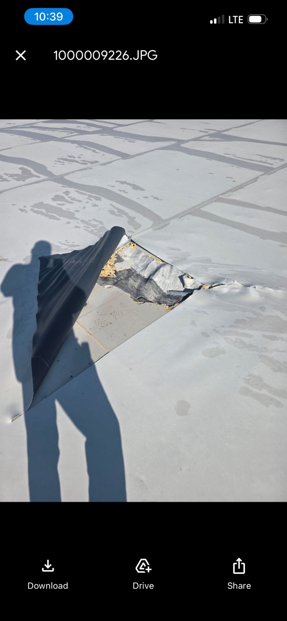 Before photo of a storm-damaged roof before work by Southeast Roofing in Hattiesburg, MS.