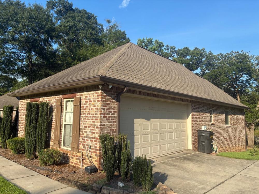 After photo of a Seamless 6" K-style gutters in Musket Brown completed by Southeast Roofing in Petal, MS.