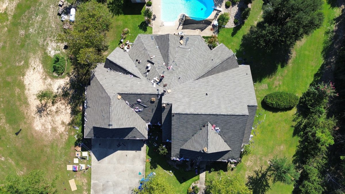 In Progress photo of a GAF Timberline HDZ shingle roof in Weathered Wood being installed by Southeast Roofing in Purvis, MS.