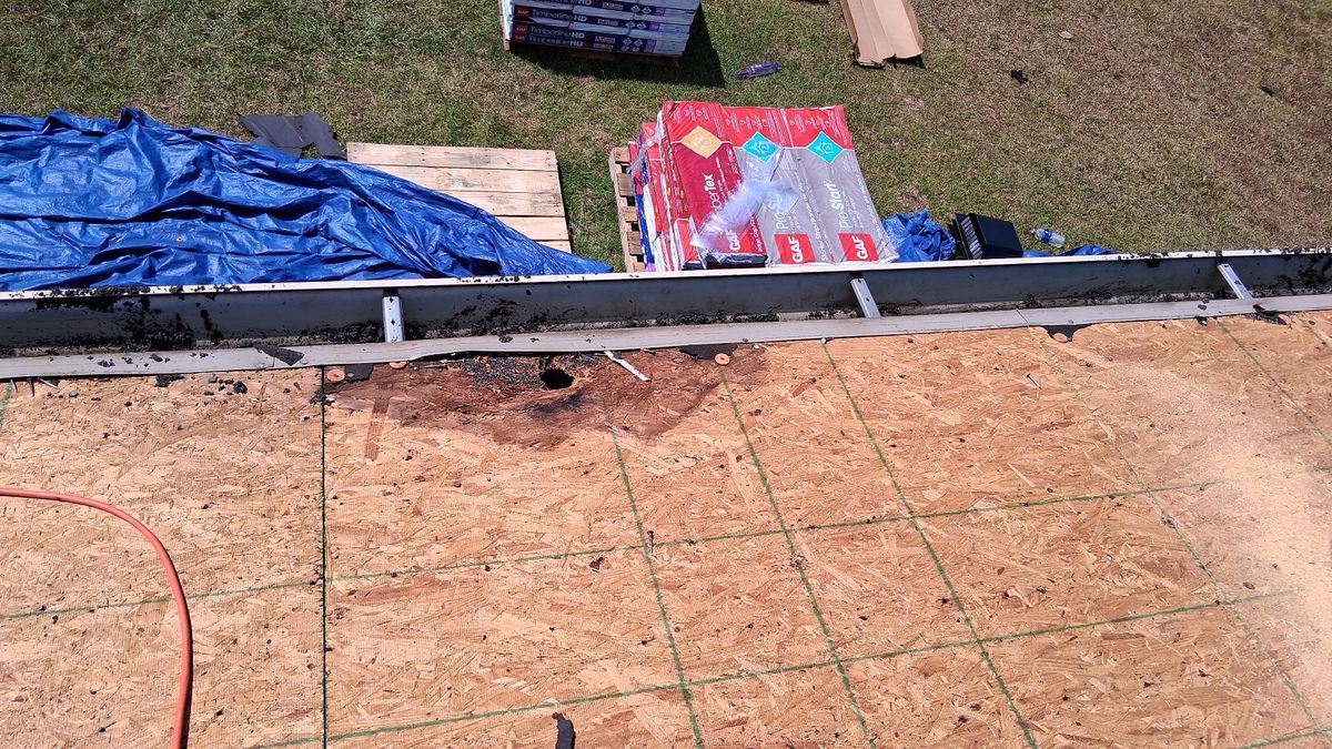In Progress photo of a GAF Timberline HDZ shingle roof in Charcoal being installed by Southeast Roofing in Perkinston, MS.