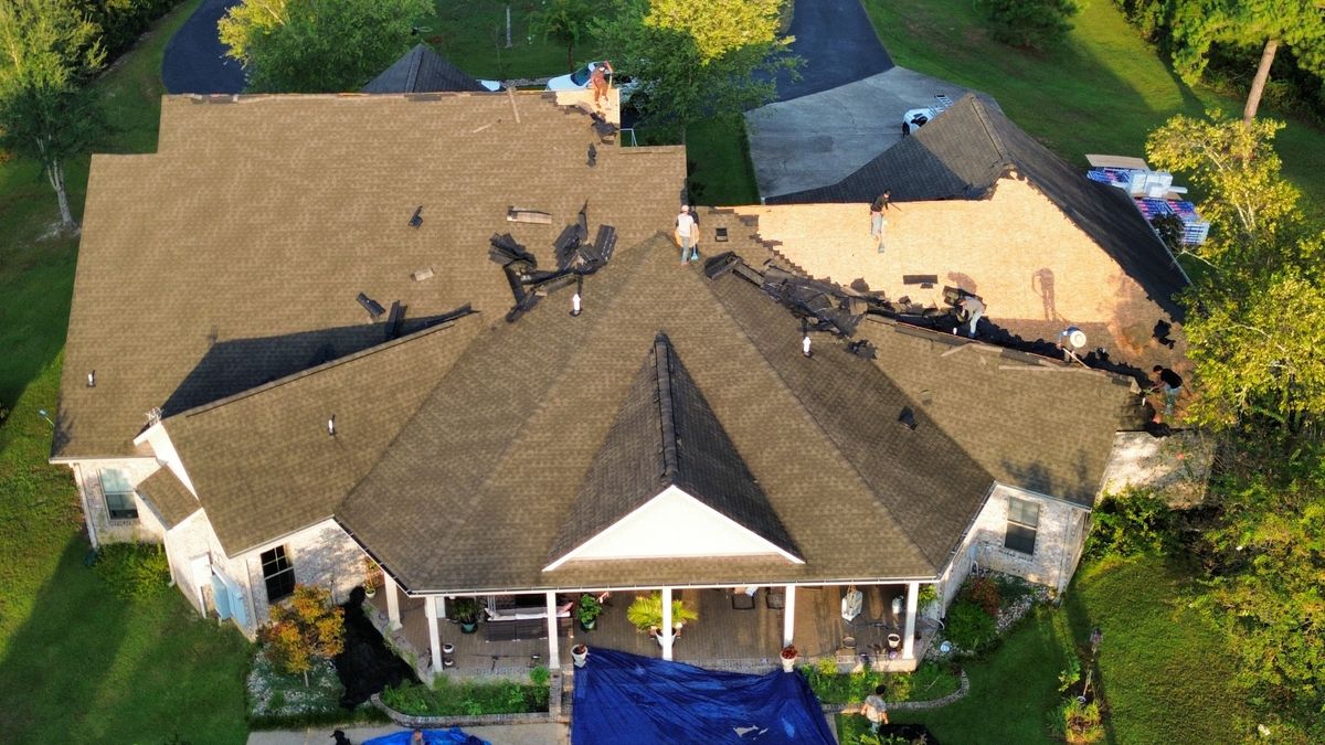 In Progress photo of a GAF Timberline HDZ shingle roof in Weathered Wood being installed by Southeast Roofing in Purvis, MS.