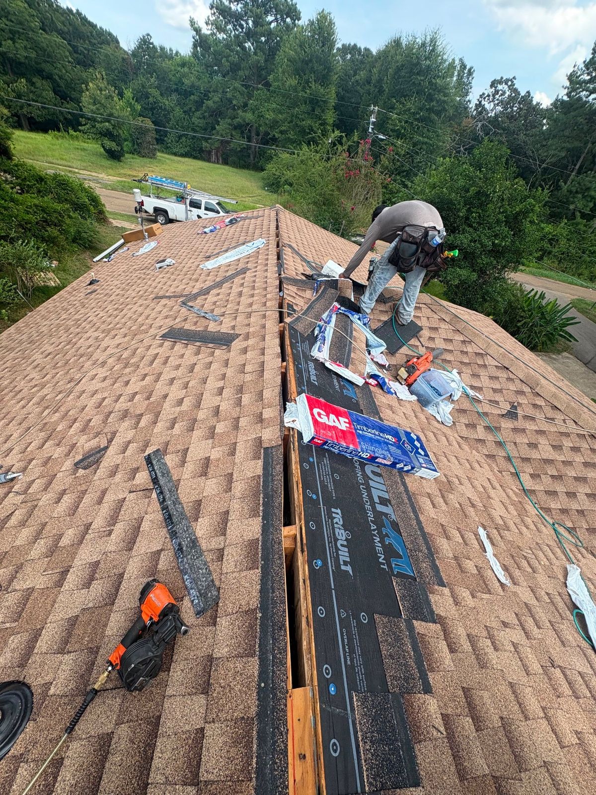 In Progress photo of a GAF Timberline HDZ shingle roof in Shakewood being installed by Southeast Roofing in McComb, MS.