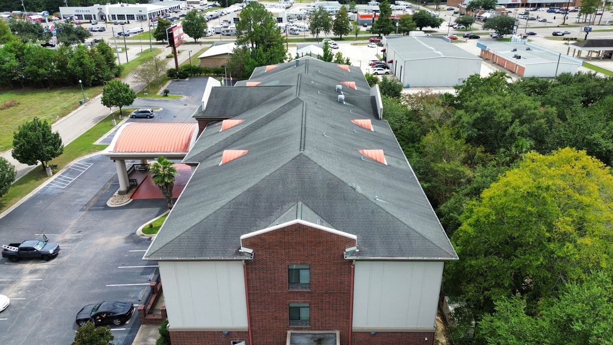 Before photo of a storm-damaged roof before work by Southeast Roofing in Picayune, MS.