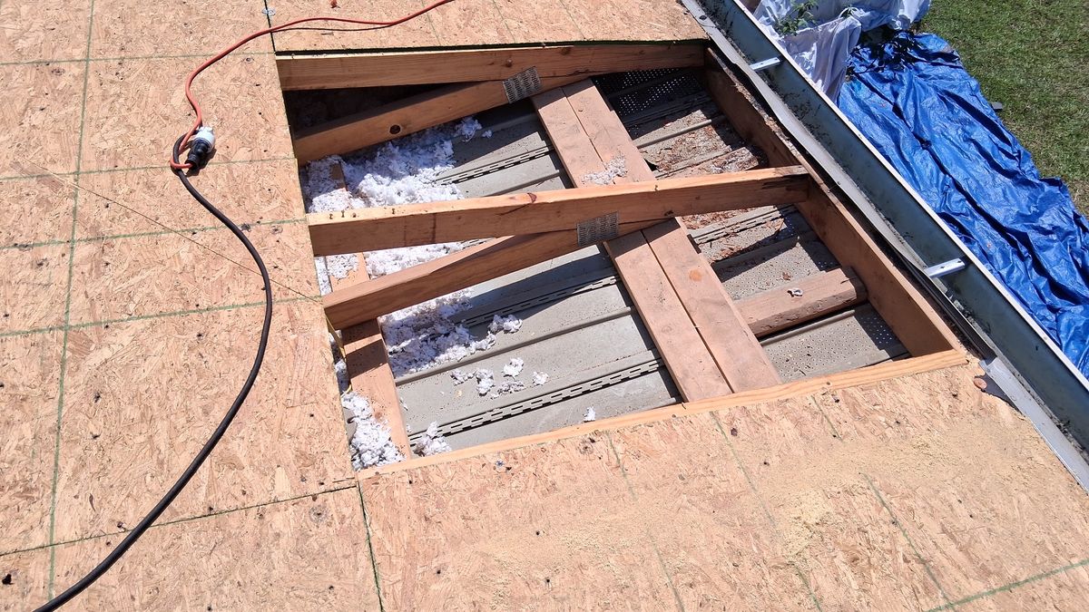 In Progress photo of a GAF Timberline HDZ shingle roof in Charcoal being installed by Southeast Roofing in Perkinston, MS.