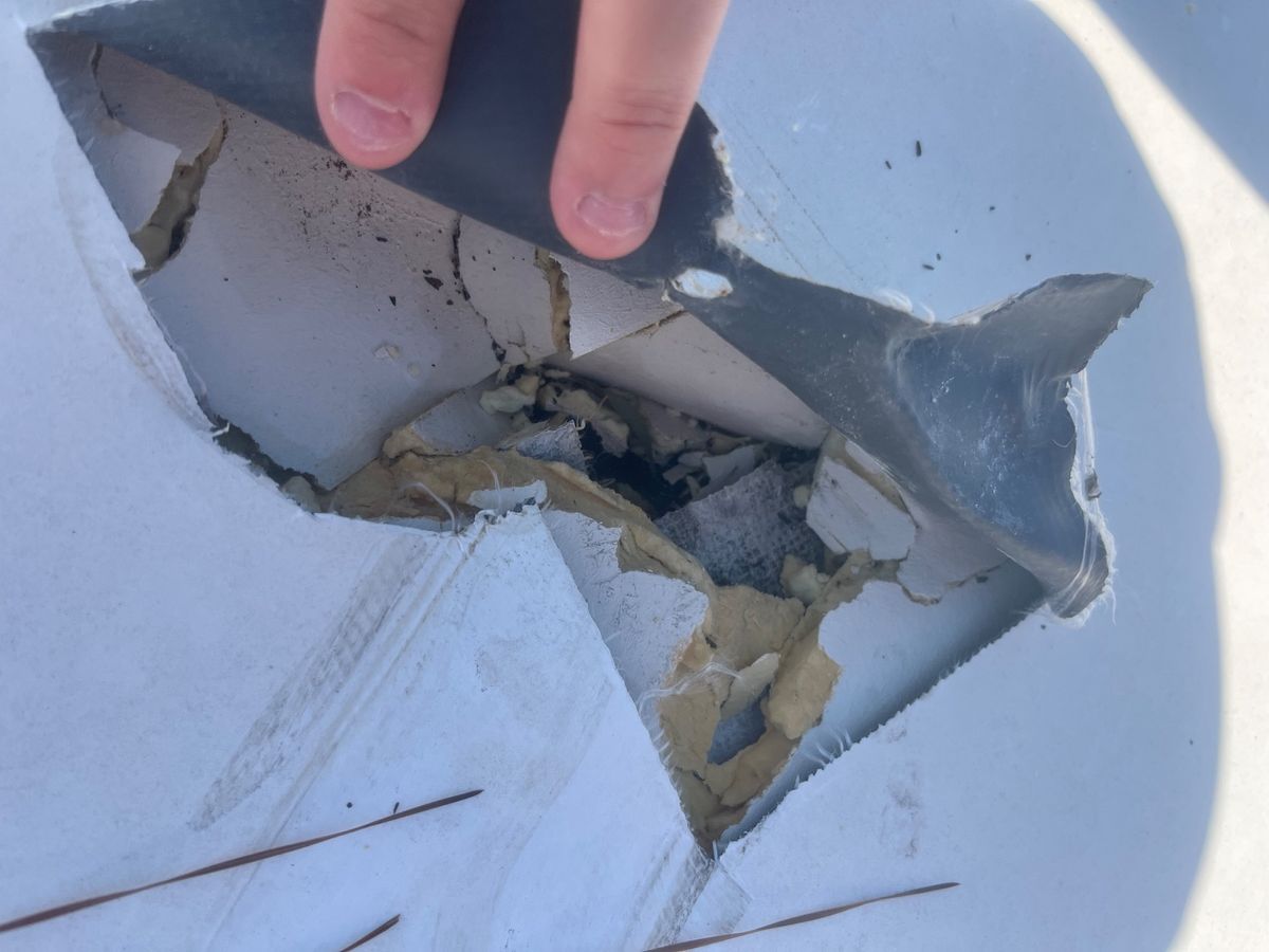 Before photo of a storm-damaged roof before work by Southeast Roofing in Hattiesburg, MS.