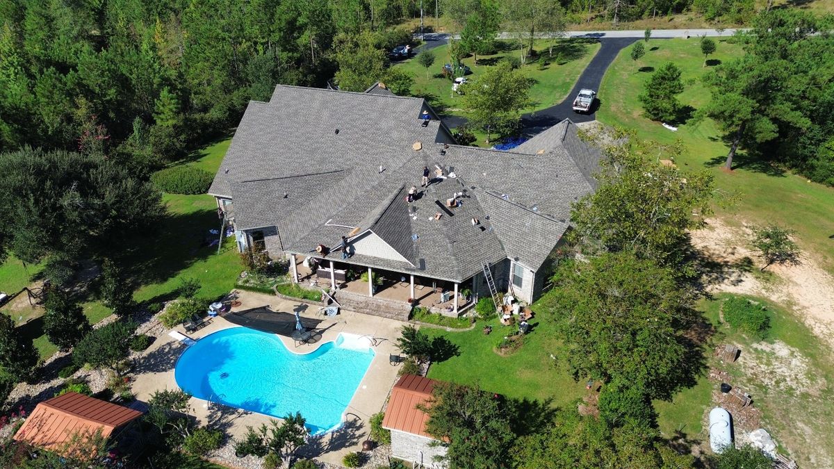 In Progress photo of a GAF Timberline HDZ shingle roof in Weathered Wood being installed by Southeast Roofing in Purvis, MS.