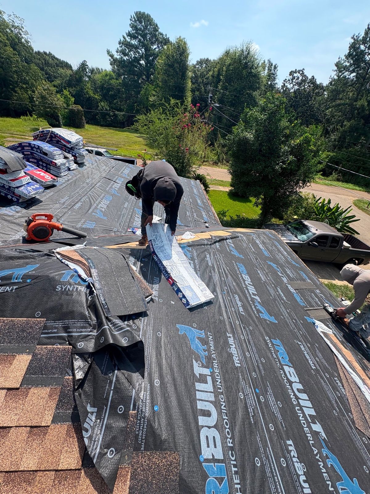 In Progress photo of a GAF Timberline HDZ shingle roof in Shakewood being installed by Southeast Roofing in McComb, MS.