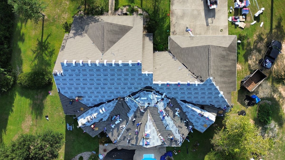 In Progress photo of a GAF Timberline HDZ shingle roof in Weathered Wood being installed by Southeast Roofing in Purvis, MS.