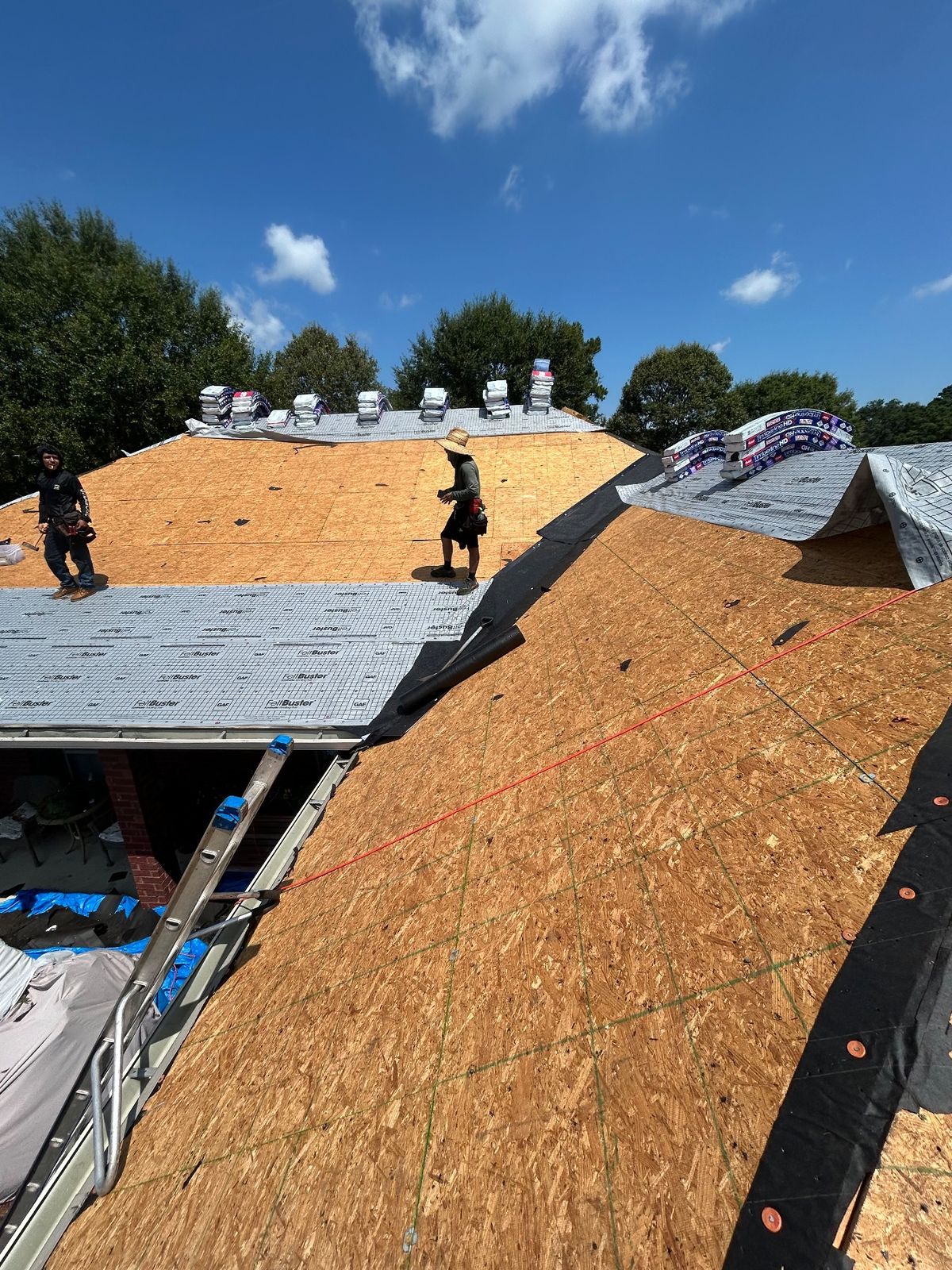 In Progress photo of a GAF Timberline HDZ shingle roof in Charcoal being installed by Southeast Roofing in Perkinston, MS.