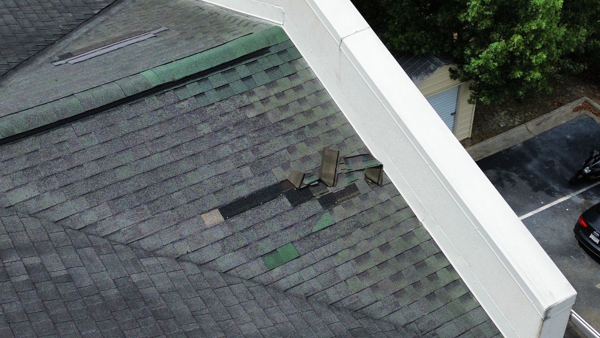 Before photo of a storm-damaged roof before work by Southeast Roofing in Picayune, MS.
