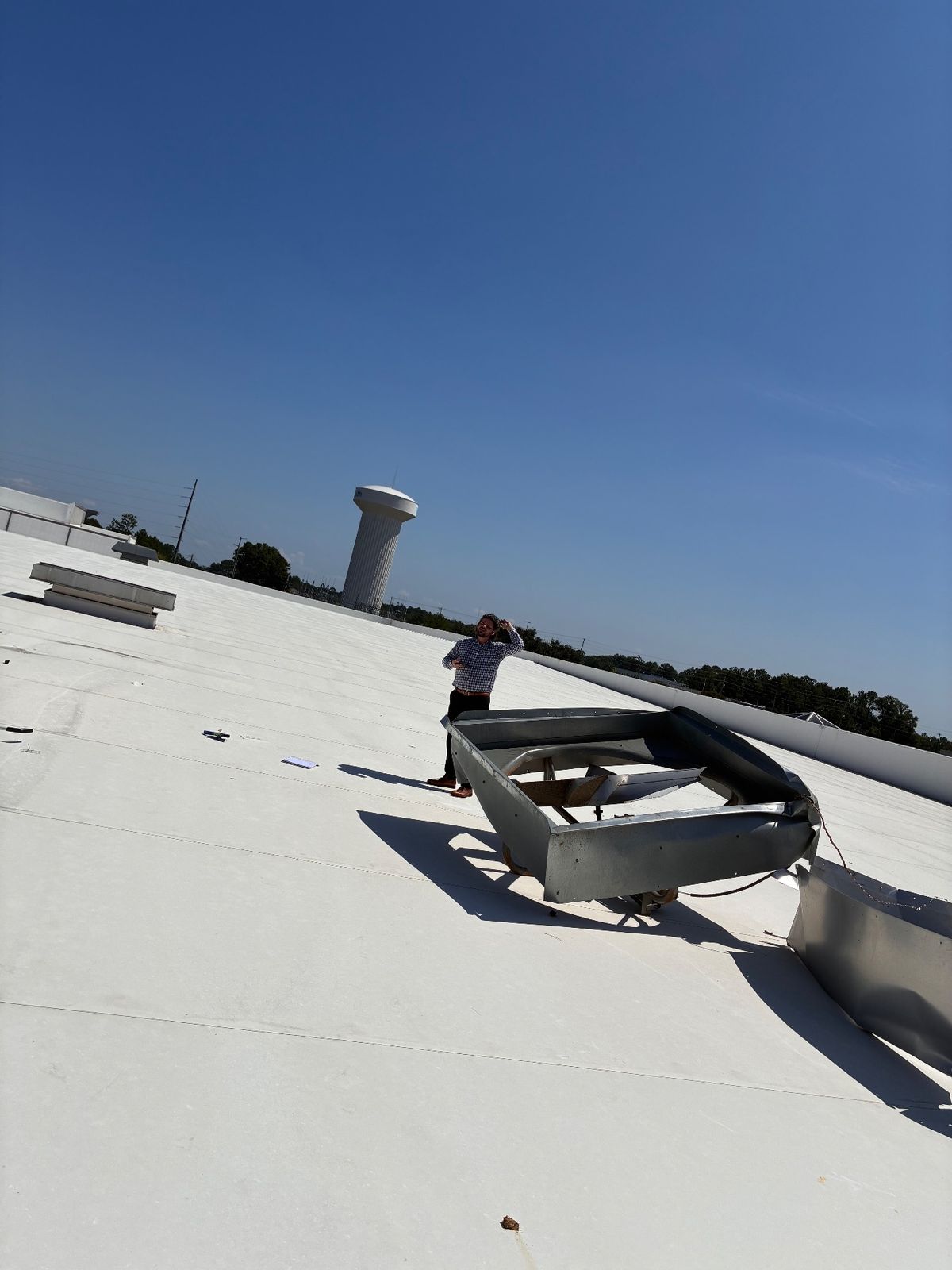 Before photo of a storm-damaged roof before work by Southeast Roofing in Hattiesburg, MS.