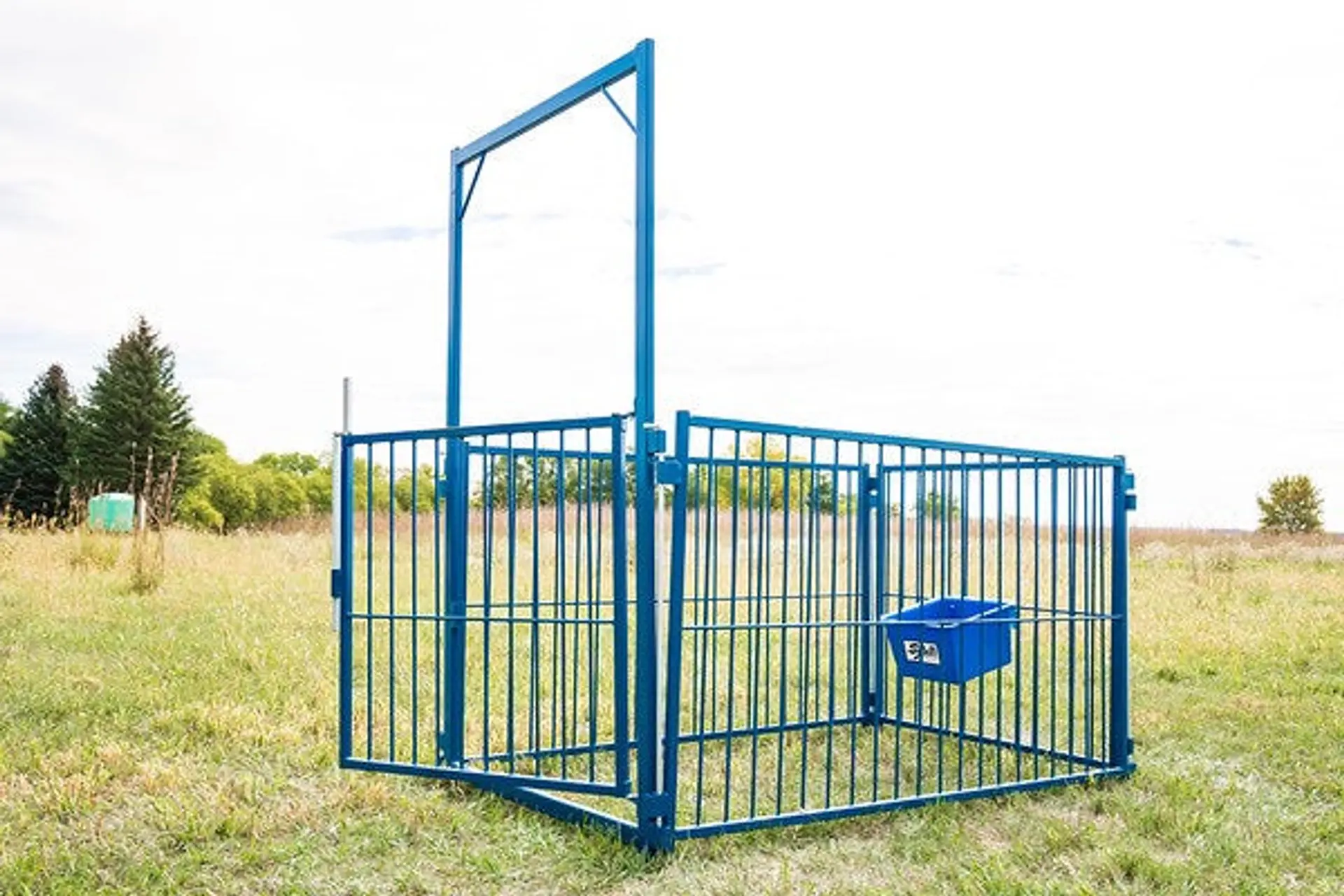 Red tandem-axle livestock feeder wagon for efficient cattle feeding