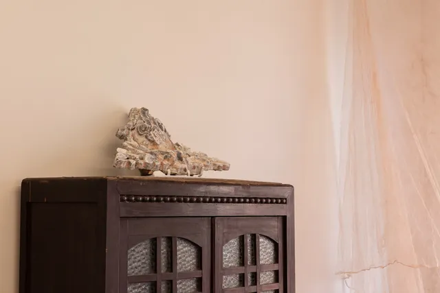 A stone installation on top of a cabinet.