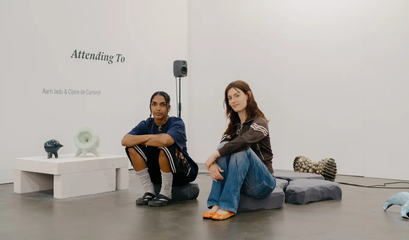 Aarti Jadu and Claire de Carteret sitting on their sound and installation work