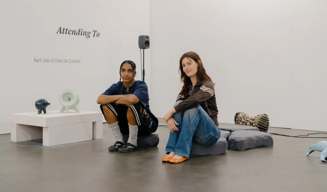 Aarti Jadu and Claire de Carteret sitting on their sound and installation work