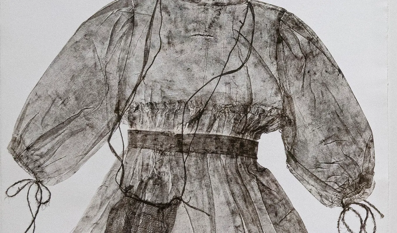 A printed dress impression, light and silky. Image of the waist up.