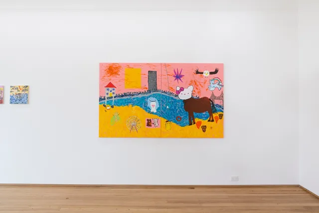 an installation shot of a large, 2 panel painting with edges touching in the middle, hangs on a white wall in the West Space Gallery. The painting depicts a city scape, meeting a beach front with a pink sky, blue water and yellow sand. All sections of the painting have painterly, sketchy marks made with darker colours of each section. There is a house with a red roof and blue windows on stilts. A large yellow rectangle floats in the sky. A large grey sky scraper with many yellow windows stands at the waters edge. There is a small blue angel girl who has jumped off the building. In the sky there is an eight pointed star with a dark pink outline and blue fill. There is a circular bird with a white face and yellow beak and wide, dark brown outstretched wings. The is a pale blue flying pony on a cloud and rainbow above a bridge in the distance. There is also a small pink angel girl falling from the bridge. In the water there is a light blue whale-like figure with a pink heart on its chest and a small penguin hanging from a noose. On the sand, from left to right, there is a small yellow duck with little orange feet. A large yellow insect with neon green wings. A small grey ferris wheel with red foundations. In a pink aura, there are two teddies arguing over something. There is a small yellow puppy with a little brown hat throwing a red ring. There is a large brown horse with the face of Hello Kitty with a white face, little pink nose, large pink bow and little black whiskers. Below the horse are four ghost like faces, two are happy red faces and two are sad brown faces.