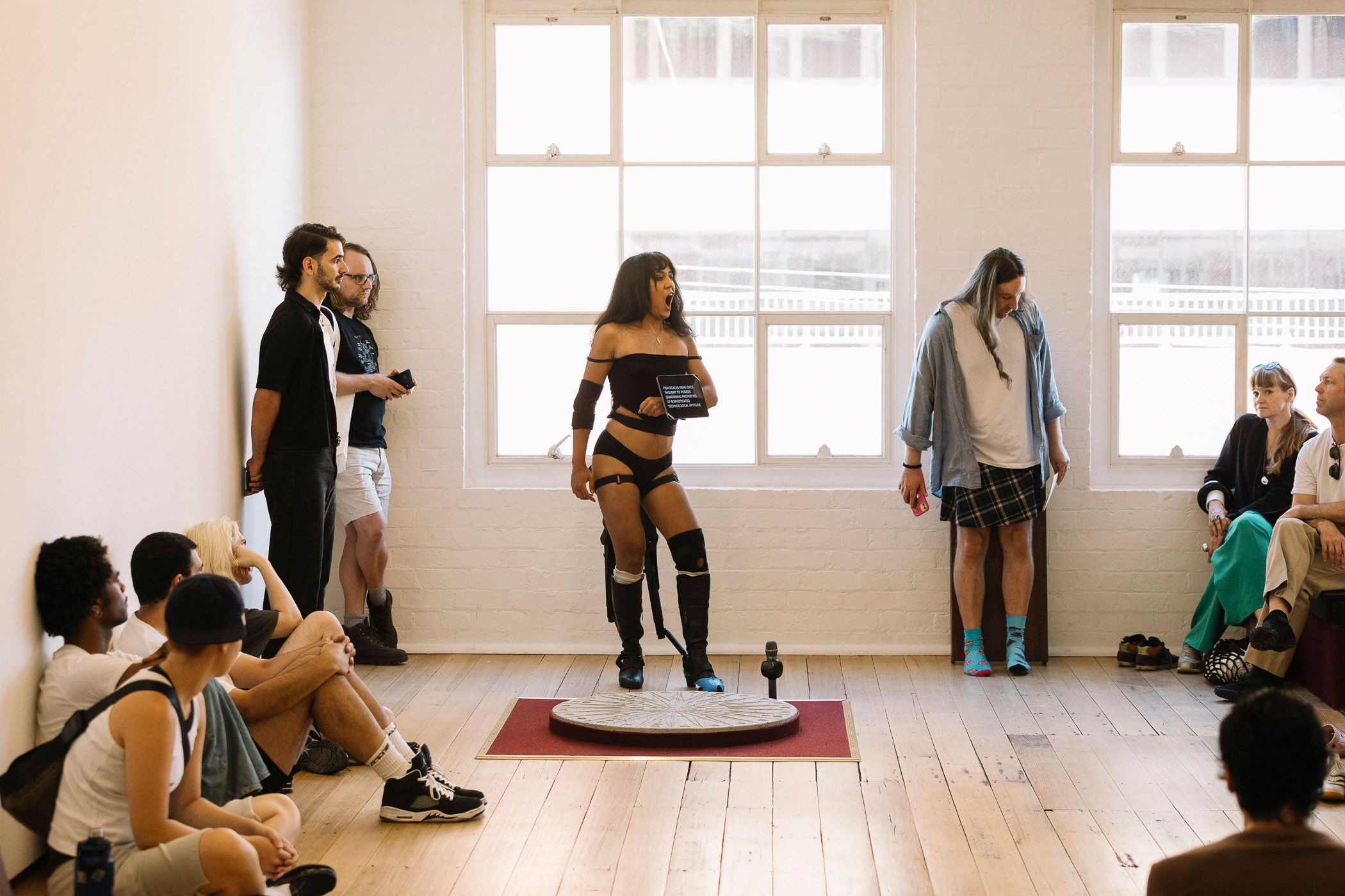 Ari performing in crowd.