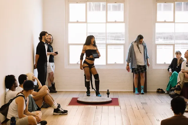 Ari performing in crowd.