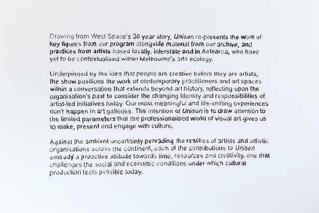 An array of text on a white surface - 3 paragraphs. Presumably on a white wall.