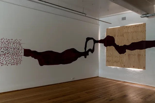 An artwork on the wall at an exhibition space.