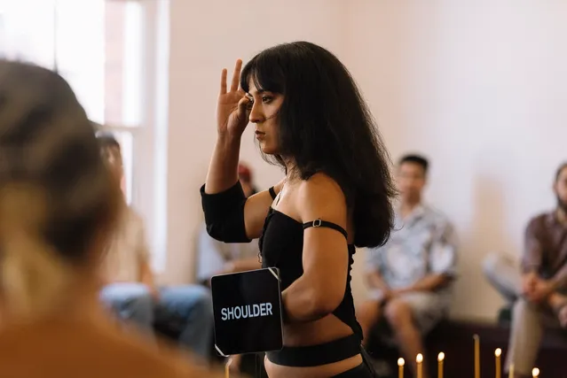 Ari performing apart of traditional Indonesian ritual in crowd.