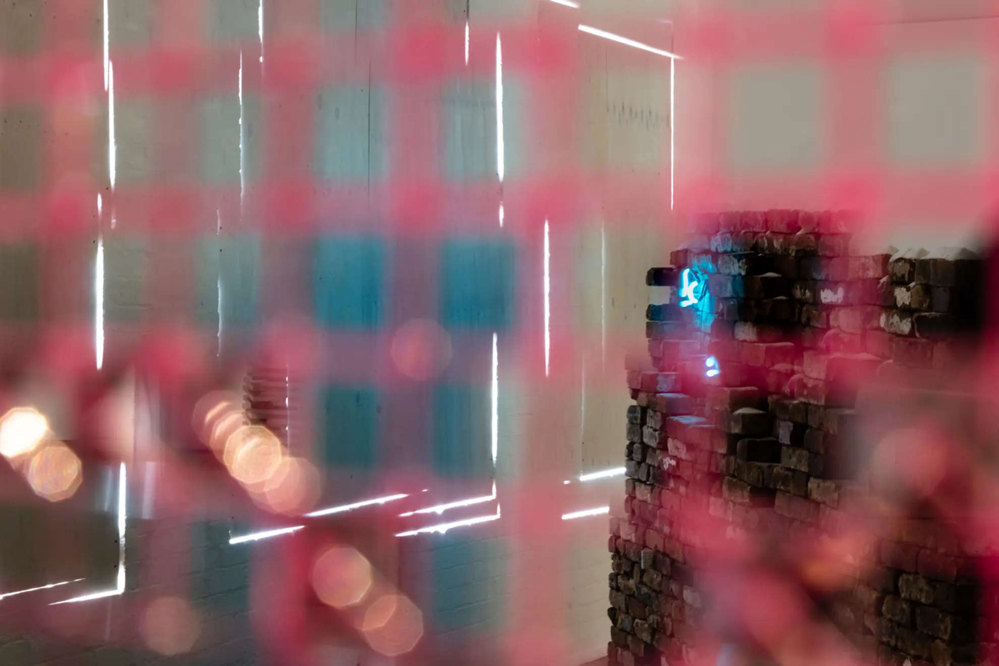 an abstracted reflection from a mosaic mirror work by Ali Tahayori showing Elyas' brick wall.