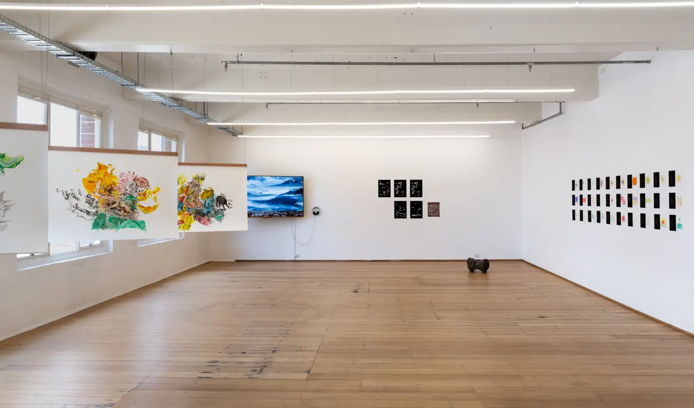 Full view of the gallery, artworks scattered around the gallery space.