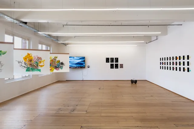 Full view of the gallery, artworks scattered around the gallery space.