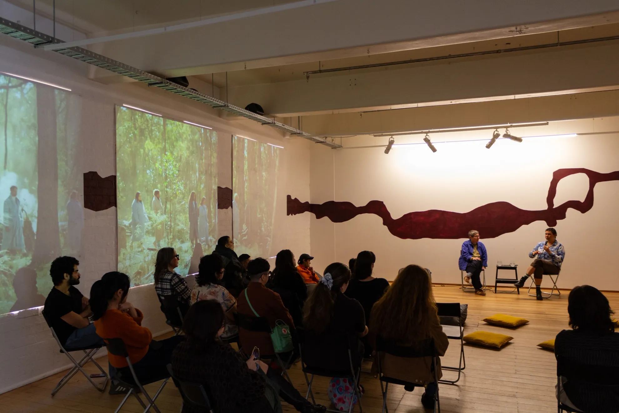 Audiences listening to Gabi Briggs in conversation with Julie Gough, West Space, Collingwood Yards, 2024. Photography by Kyle Archie Knight.