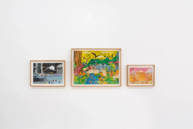 Three of Lionel Grijalva's pairing are hanging on a white wall. Each work depicts an abstract and expressive imaginative landscape. The painting on the left is a dark night time forrest scene with a mountain and moon in the background and a blue lake with brown animals or creatures batting in it. The Central painting is larger that the other two. It is vibrant and colourful and features abstract images of a lush day time landscape with many dinosaurs sharing the scene. In the third painting on the right, the artist has used pink, orangeade yellow colours to depict a sun setting in a landscape with an expressive drawing of a mammoth in the centre.