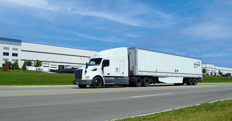 A white semi-truck on the road