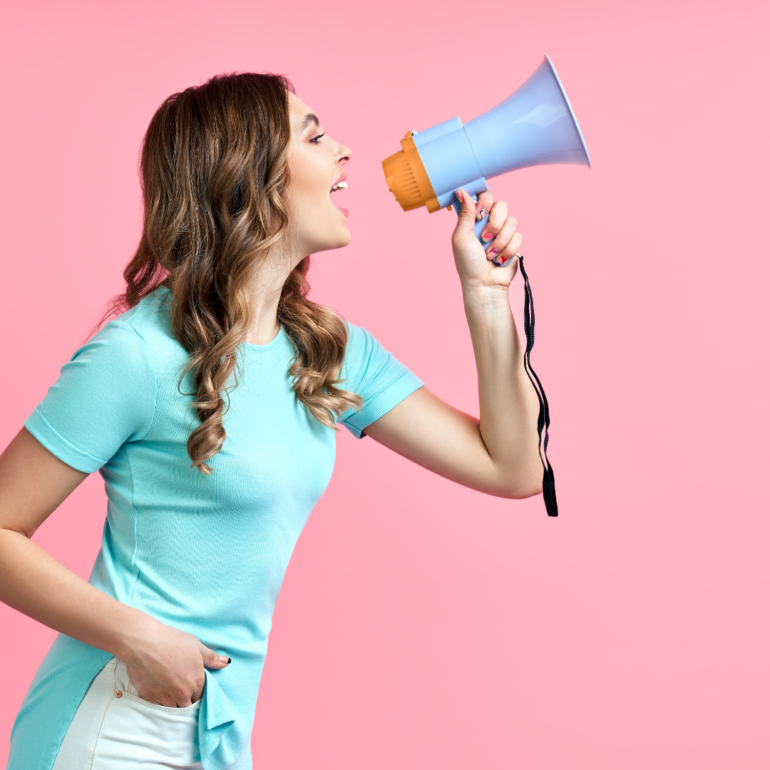 Depicts a woman speaking into a megaphone against a pink background, symbolizing outreach and communication with an audience.